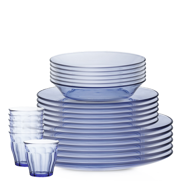 Duralex Lys. 24 Piece Dinnerware Set. Six blue marine dinner plates, six blue marine dessert plates, six blue marine soup bowls, and six blue marine medium sized tumblers which have beveled sides. Ensemble de vaisselle de 24 pièces. Six assiettes à dîner bleu marine, six assiettes à dessert bleu marine, six bols à soupe bleu marine, et six tumblers de taille moyenne bleu marine avec des côtés biseautés.