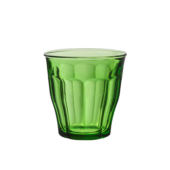 Duralex Lys. A green glass tumbler with beveled edges. Un tumbler en verre vert avec des bords biseautés.